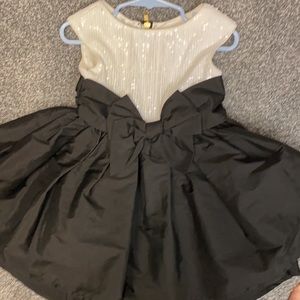 White Sequins and high low black dress with bow